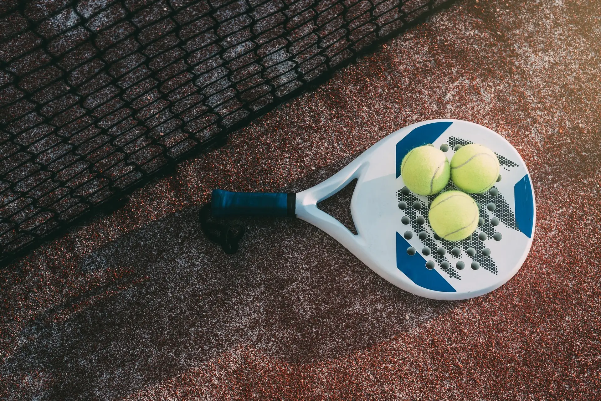 Padel blade racket on the floor